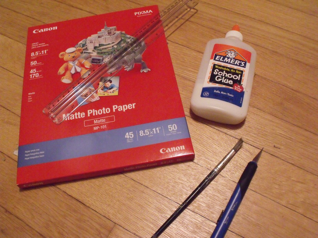 Photo paper, ruler, glue, brush, knife. Steady hands not included. Also not included: Card stock, laminator, etc.